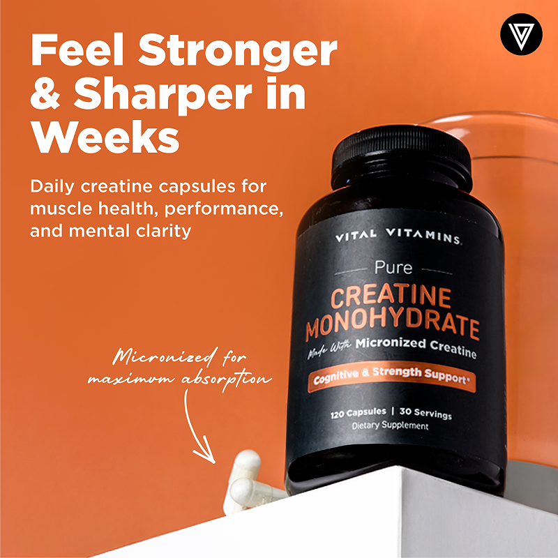 A single green leaf in a clear glass of water on white background.