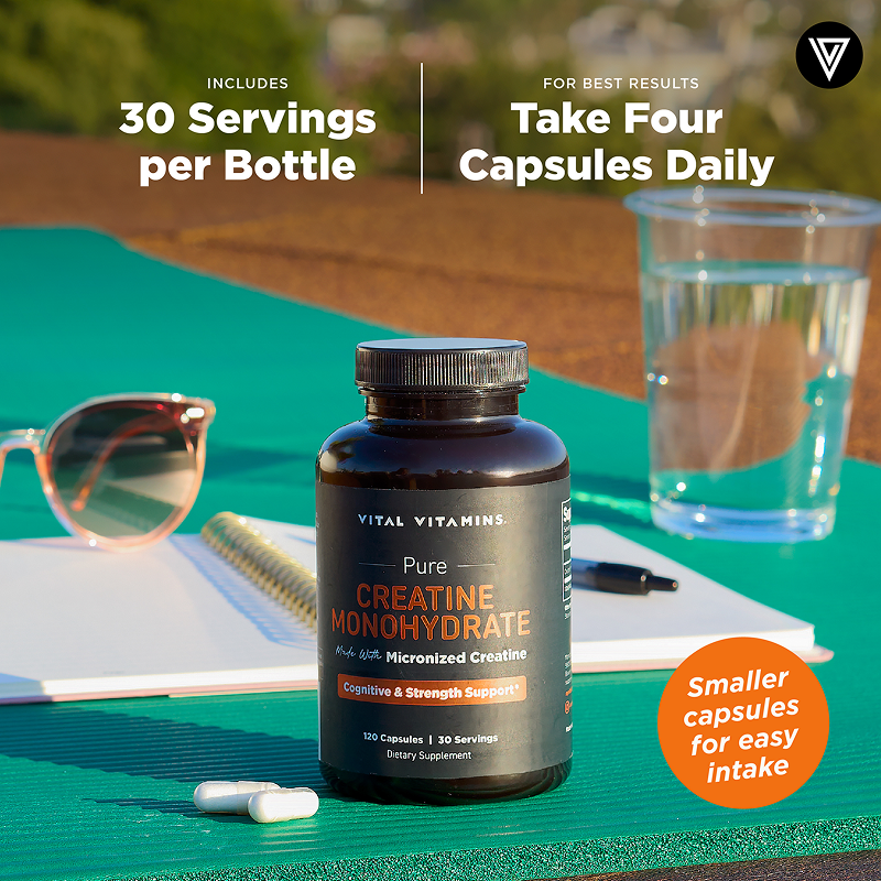 A single Monstera leaf in a clear glass vase against a white background.