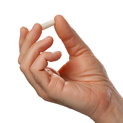 Hand holding a single Multi-Collagen Complex Plus capsule on a clean background - Vital Vitamins beauty collagen supplement
