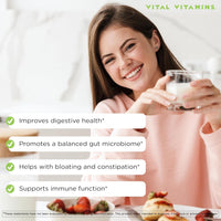 Smiling woman holding a glass - Vital Vitamins Probiotic Complex supports digestion, balanced gut microbiome and immune function