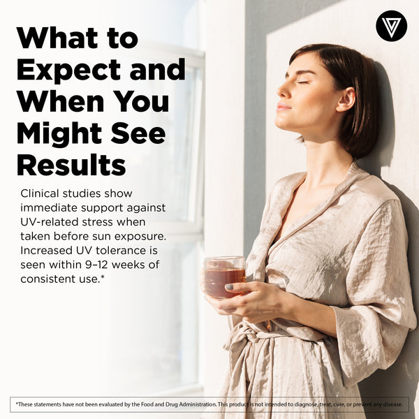 Woman looking through a sunlit window with clear skin - what to expect from Vital Vitamins Sun Support Complex over time